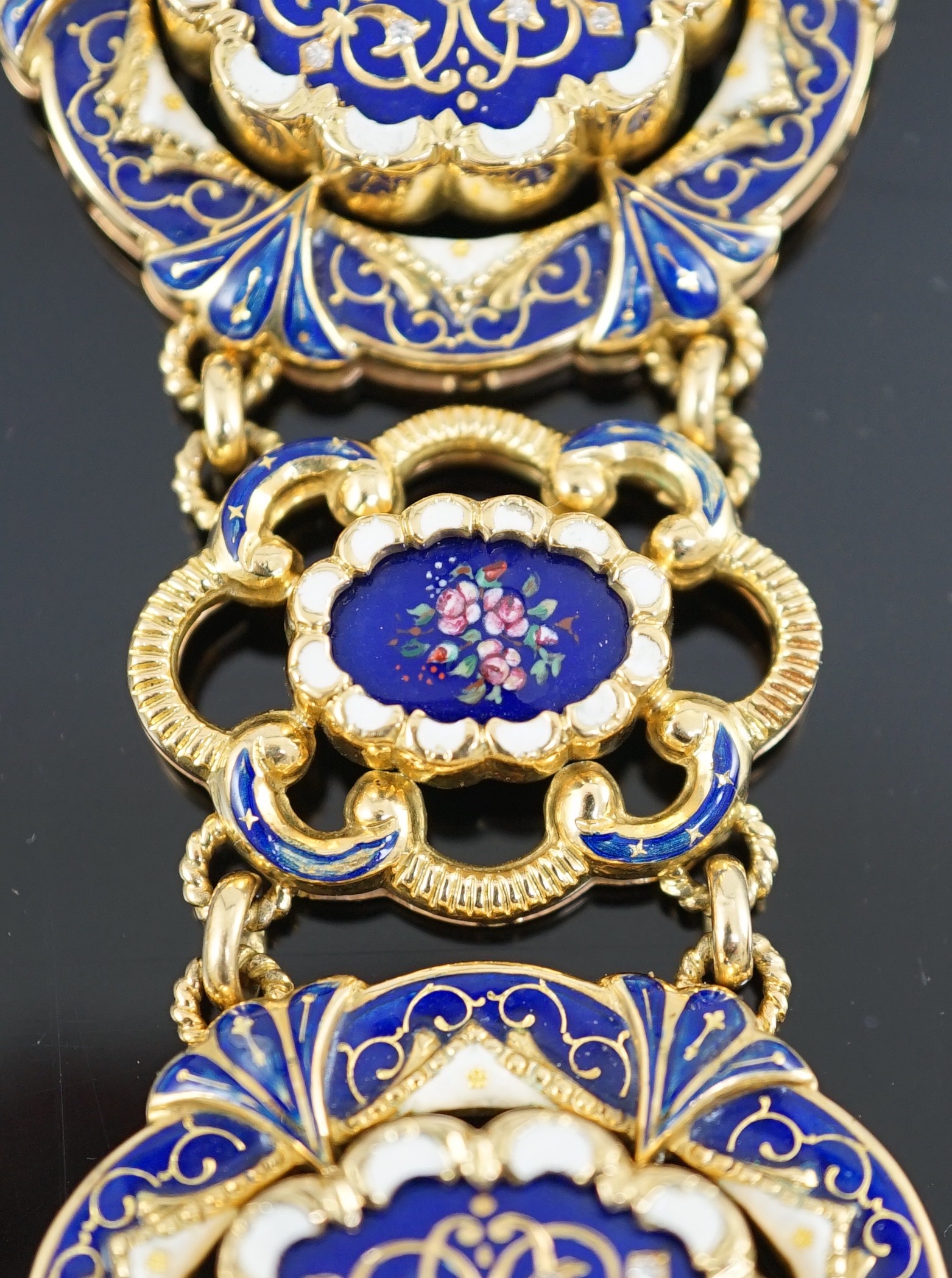 A mid 20th century Swiss 18ct gold and polychrome enamelled suite of jewellery, retailed by E. Meister, Zurich